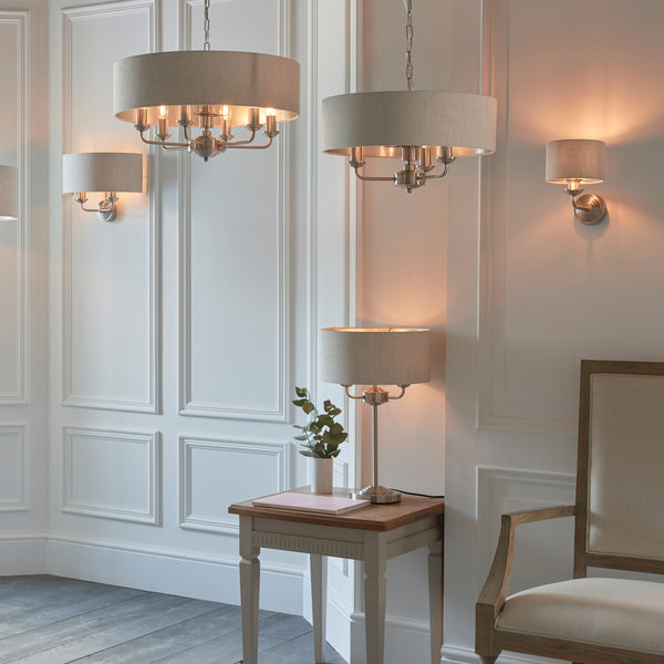 Round cream pendant light above a dining table