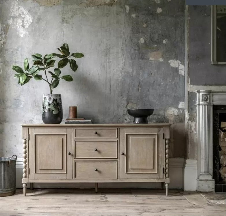 wooden 3 door and 2 door sideboard. with an oak colour finish, round black handles and a panel effect on each door and drawer. with a round bobbin effect on each corner