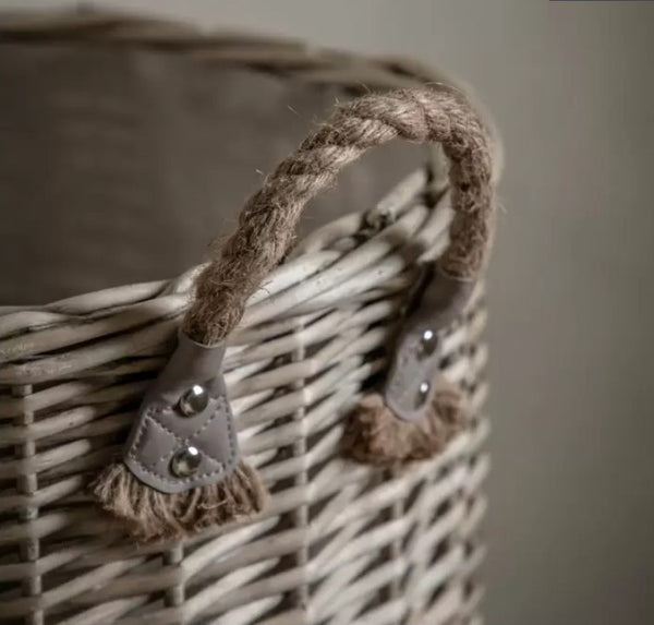 close up of rope handle of the brown wicker basket
