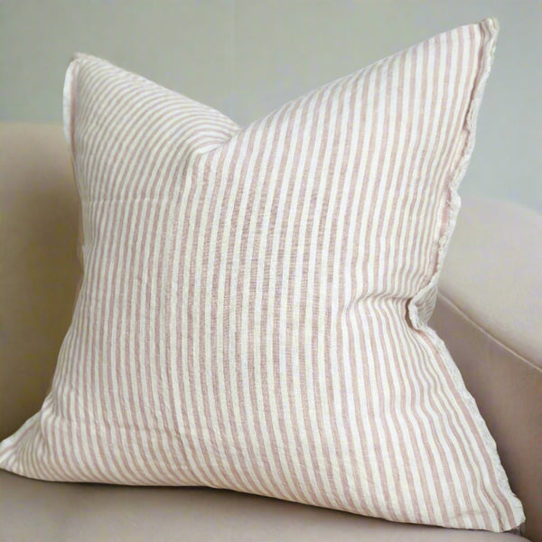 square cream cushion with repeating vertical dusky pink stripes 